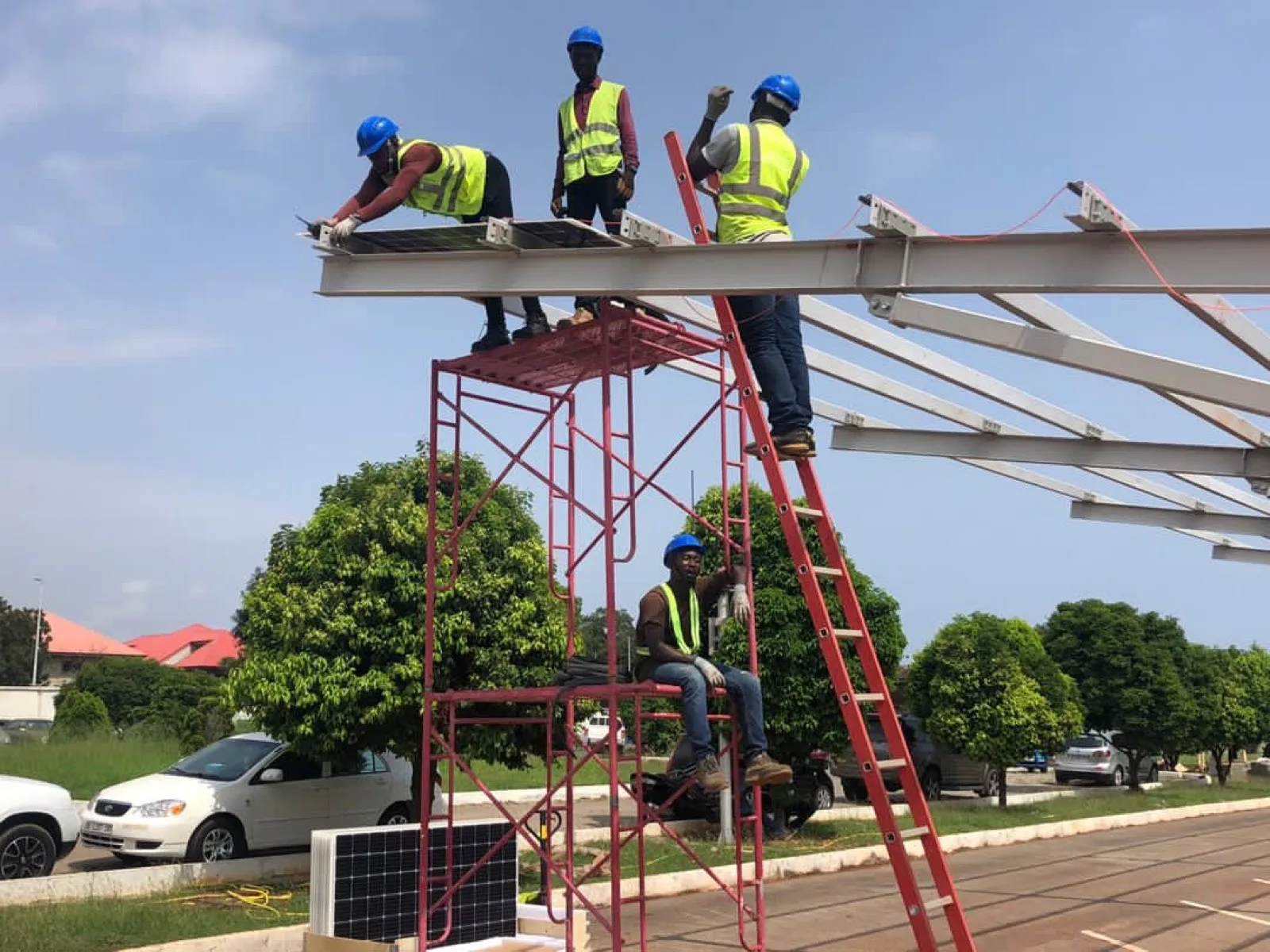 Student installing solar systems on internship